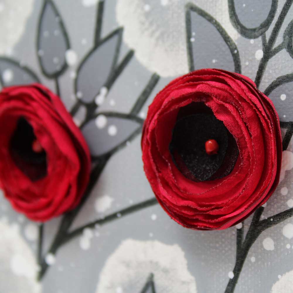 Close up of wall art painting of gray and red rose branch