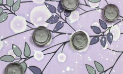 Center view of nursery art flowers in lilac an gray