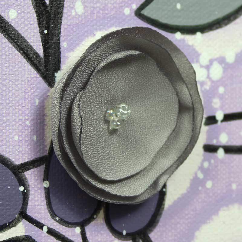 Close up of nursery art flowers in lilac an gray