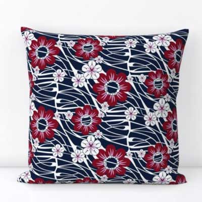 Pillow with red and blue Hawaiian floral pattern
