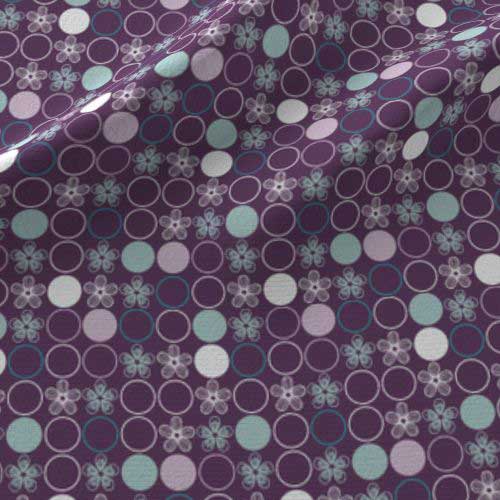 Polka dot print on fabric in purple, aqua, gray