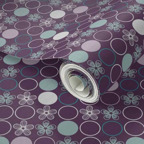 Wallpaper roll with gray and teal polka dots on purple