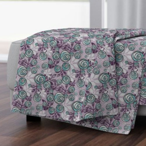 Throw blanket with teal and purple roses