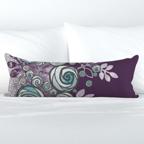 Bolster pillow with large teal and purple roses