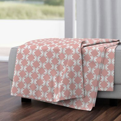 Throw blanket with pink geo pattern