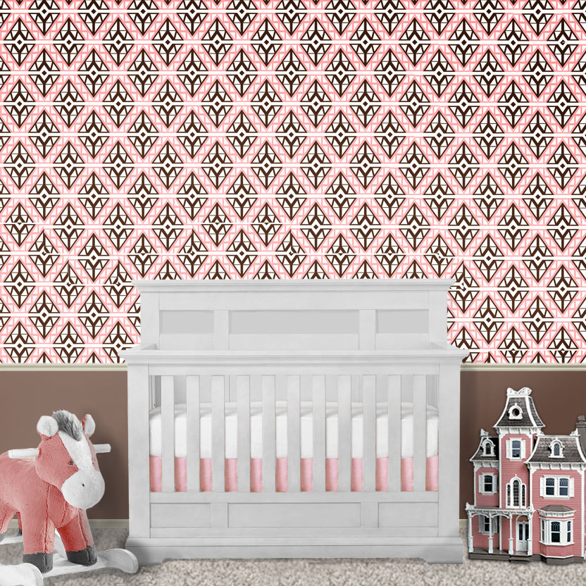 Wallpaper in nursery behind crib in pink and brown diamonds