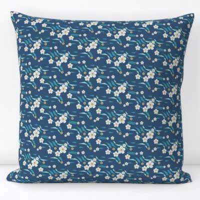 Pillow with ditsy floral on dark blue