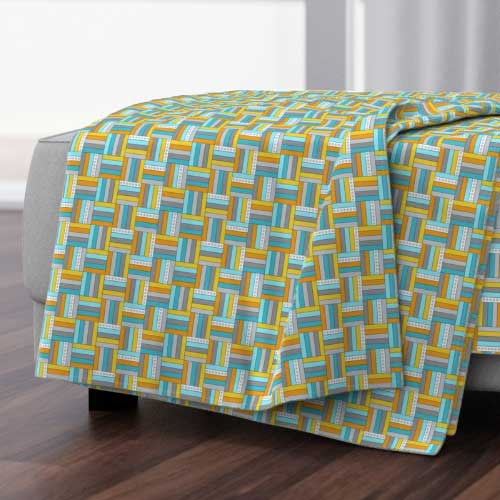 Throw blanket with basketweave patchwork in teal and yellow