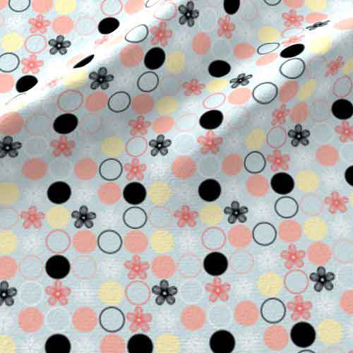 Flower and dot fabric in blue, peach, and black