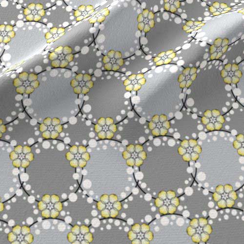 Fabric print of flower garlands and dots in yellow and gray