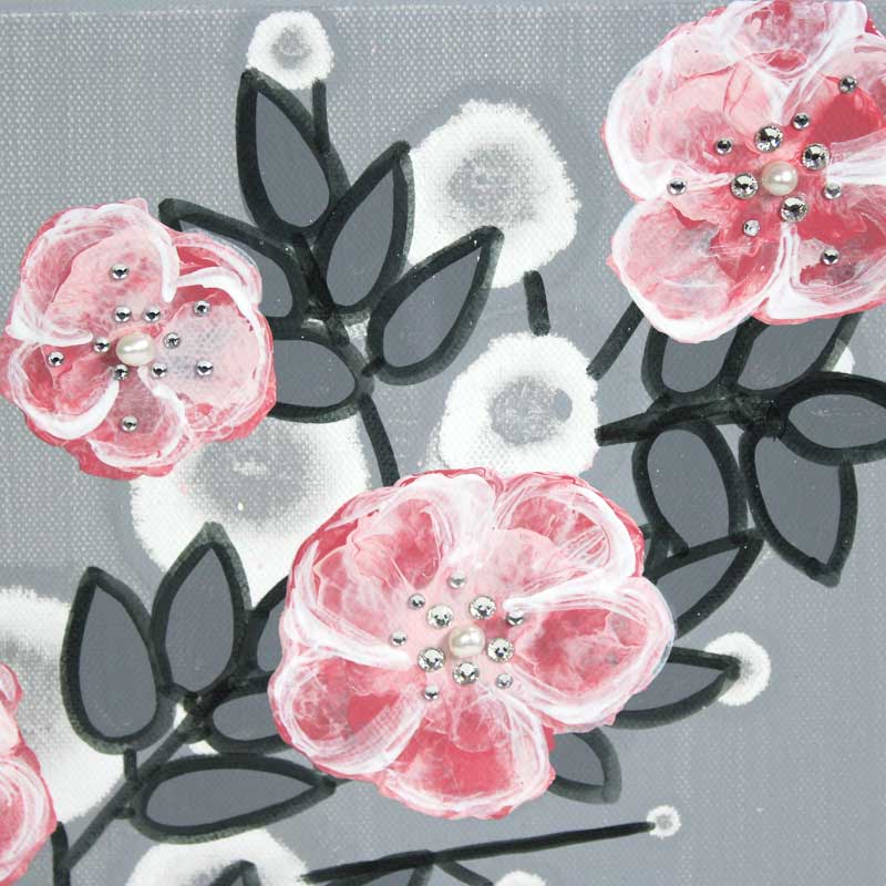 Close up of small nursery art pearl and crystal roses in gray and pink
