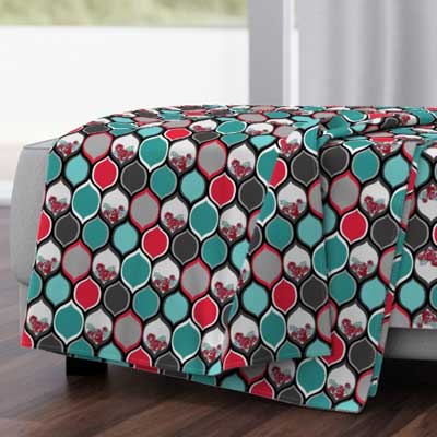 Throw blanket with red and teal pattern