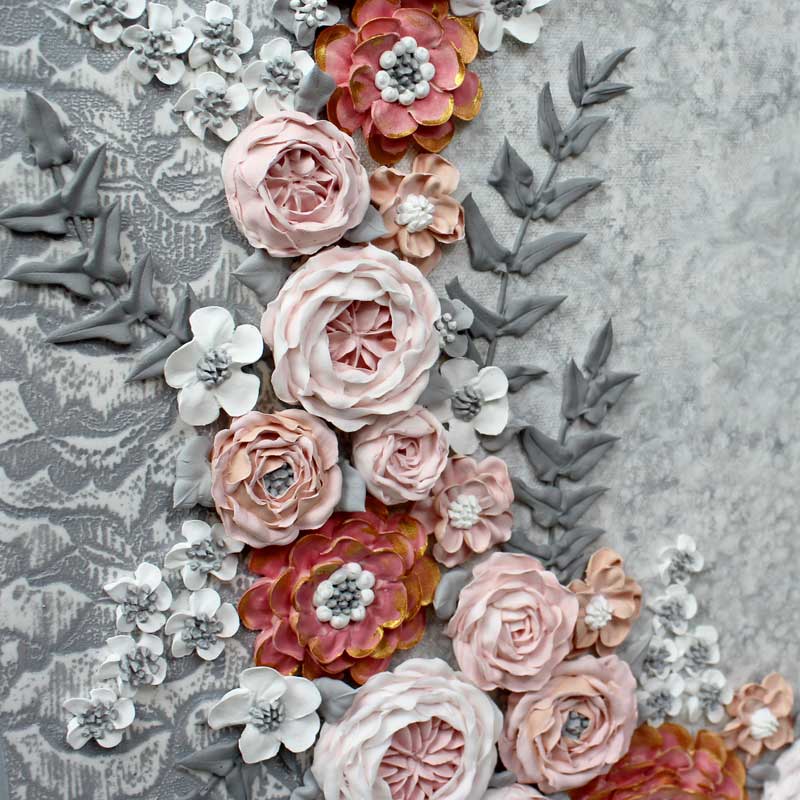 Close up of flowers on pink and gray wedding art