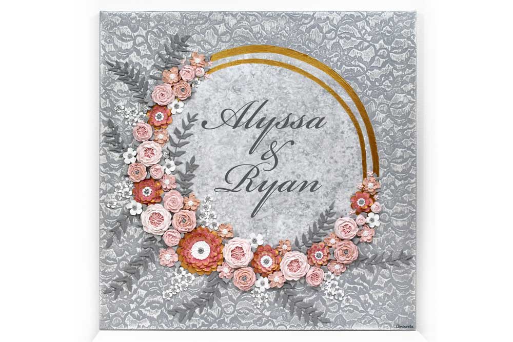 Front view of pink and gray floral rings wedding art with custom inscription