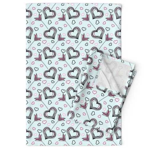 Valentine's day tea towels with heart arrows on light teal