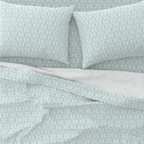 Bed sheets with soft teal and white lattice