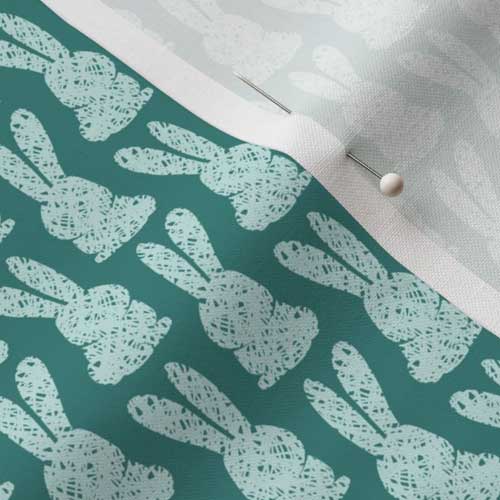 Close up of teal bunny stamped fabric