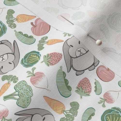 Close up of white fabric with rabbits in garden food