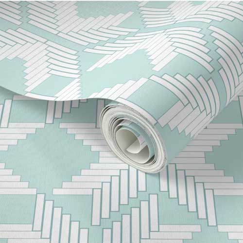 Close up on wallpaper roll with soft teal and white lattice