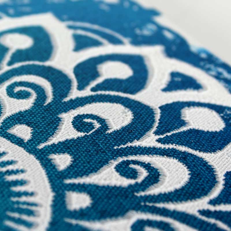 Close up of art with blue and white mandala