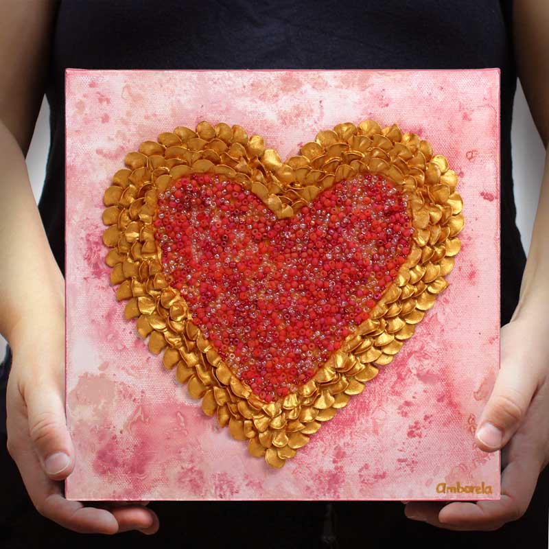 Scale of art of pink and gold sculpted heart
