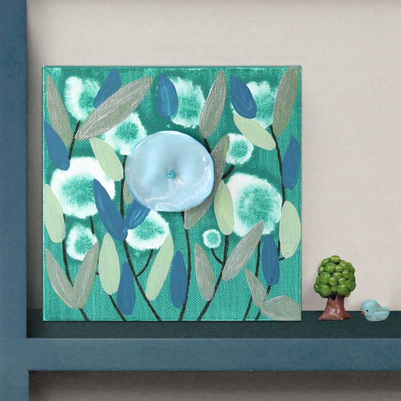 shelf setting view of mini painting of blue flower
