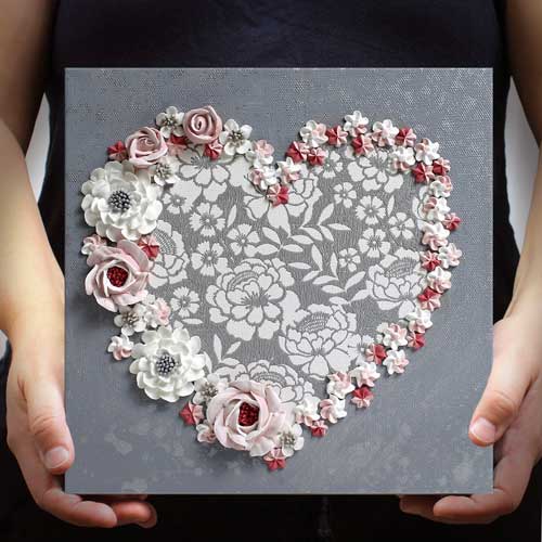 Heart painting of pink and white roses on a gray lacy painting