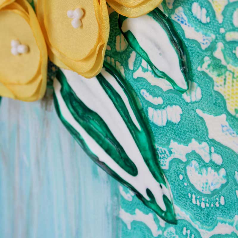 Close up of leaves on yellow and teal floral still life