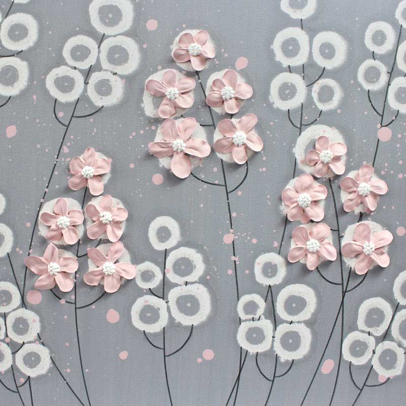 Center view of big nursery art of pink and gray flowers on 3 canvases