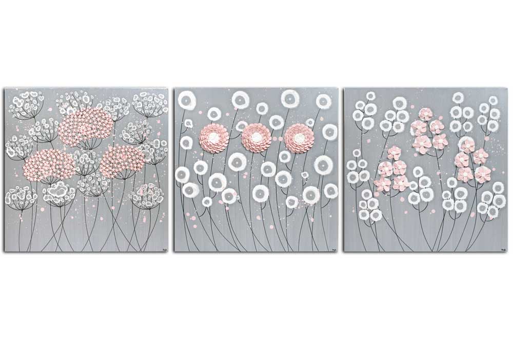 Front view of big nursery art of pink and gray flowers on 3 canvases