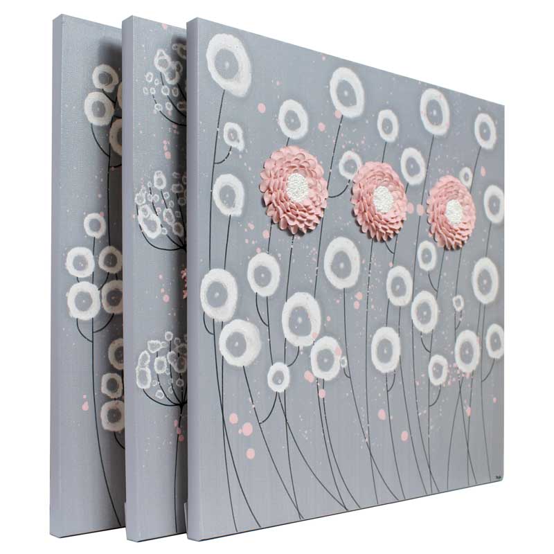 Side view of big nursery art of pink and gray flowers on 3 canvases