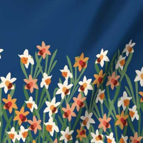 Border fabric with orange and white daffodils on navy
