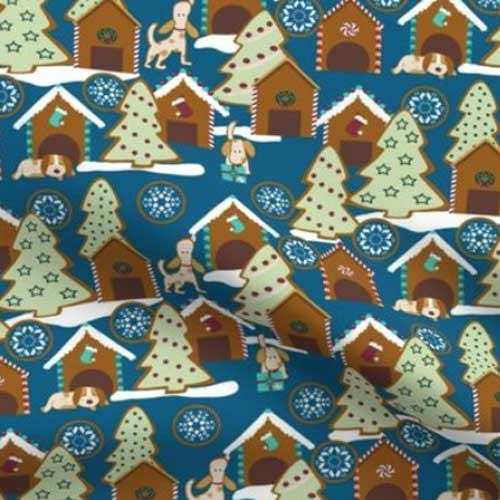 Fabric with gingerbread houses and dog cookies on blue