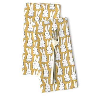 Easter dinner napkins with marshmallow bunnies on yellow