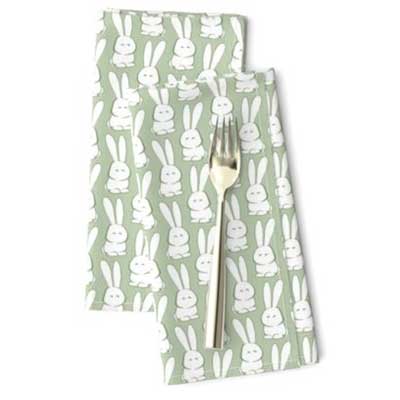 Easter dinner napkins with marshmallow bunnies on green