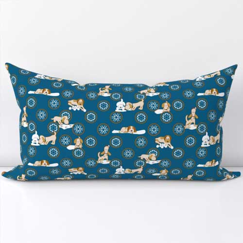 Pillow with gingerbread dog cookies playing in snow frosting on blue