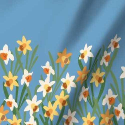 Border fabric of daffodils on true blue for dress hem