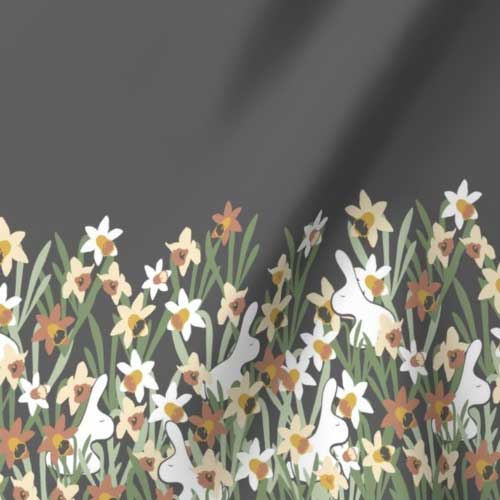 Gray border fabric of bunnies hiding in daffodils