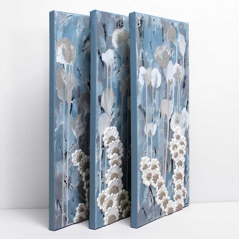 Side view of triptych art with blue abstract ocean