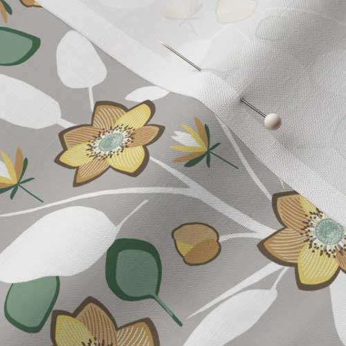 Close up of fabric with earth toned anemone flowers