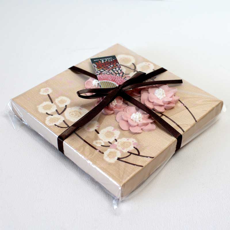 Packaging view of beige and pink wildflower painting on mini canvas